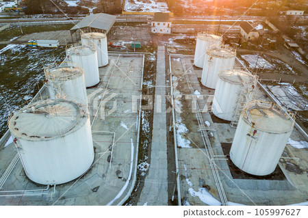 Aerial view of big fuel reservoires in petrol industrial zone in winter. 105997627