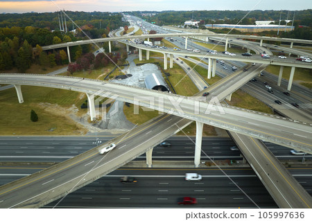 Aerial view of american freeway intersection with fast moving cars and trucks. USA transportation infrastructure concept 105997636