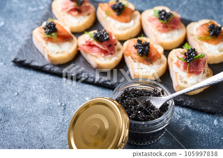 Bottled caviar and caviar appetizers 105997838