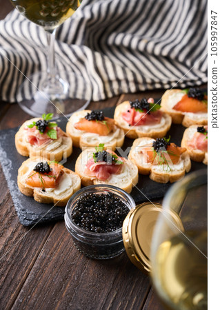 Bottled caviar and caviar appetizers 105997847
