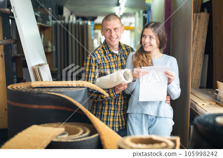 Happy married couple shopping at hardware store 105998242