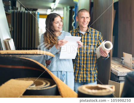 Happy married couple shopping at hardware store 105998250