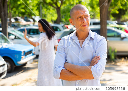 couple having a quarrel outside 105998336
