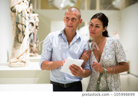 Man and woman in museum Man and woman in museum 105998699