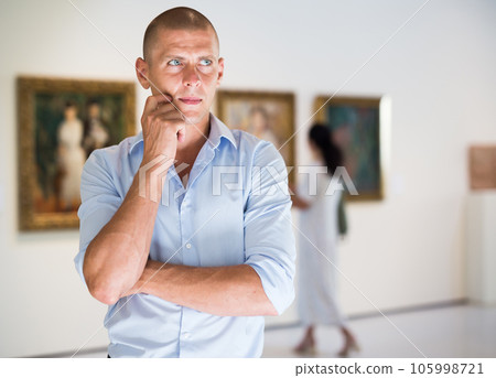 Adult man in gallery Adult man in gallery 105998721
