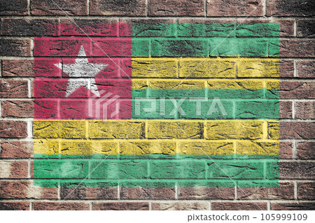 Togo flag on a brick wall background Togo flag on a brick wall background 105999109
