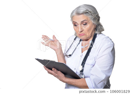 senior female doctor with folder on white background senior female doctor with folder on white background 106001829