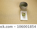 Matcha tea bowl with matcha and Japanese sweets on paper 106001854