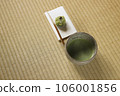 Matcha tea bowl with matcha and Japanese sweets on paper 106001856