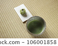 Matcha tea bowl with matcha and Japanese sweets on paper 106001858