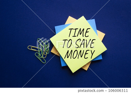 Time to save money symbol. Yellow steaky note with words Time to save money. Beautiful deep blue background. Business and Time to save money concept. Copy space. Time to save money symbol. Yellow steaky note with words Time to save money. Beautiful deep blue background. Business and Time to save money concept. Copy space. 106006311