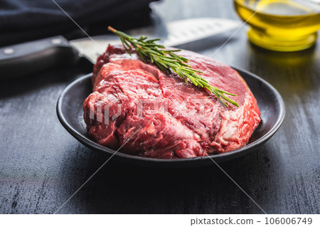 Raw fillet steak beef meat on plate. 106006749