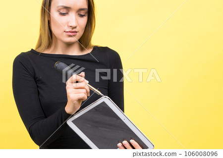 Service center. Laptop Repair. Female screwdriver unscrews laptop bolts on yellow background 106008096