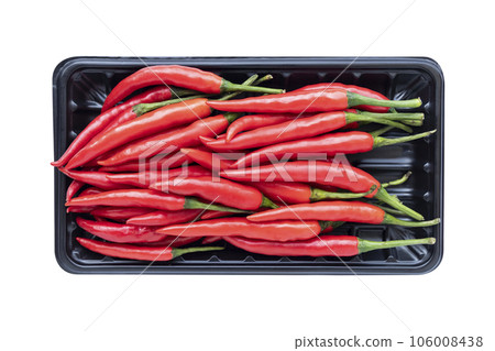 Top view of chili on black tray on isolated white background Top view of chili on black tray on isolated white background 106008438