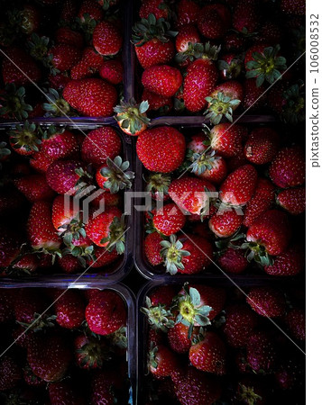 Strawberries in plastic containers. fresh berryes. red and dark Strawberries in plastic containers. fresh berryes. red and dark 106008532