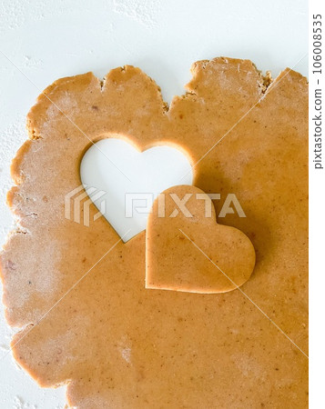 The process of cooking heart cookies. Top view raw The process of cooking heart cookies. Top view raw 106008535