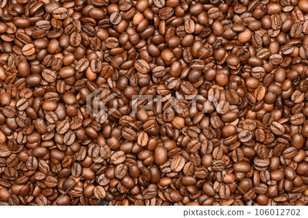 Roasted coffee beans background top view Roasted coffee beans background top view 106012702