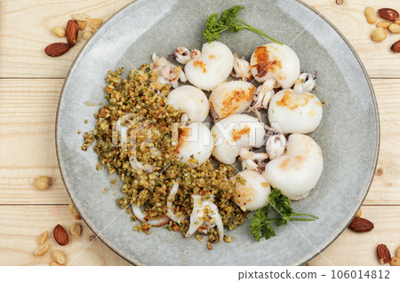 Grilled squids with nuts. Grilled squids with nuts. 106014812