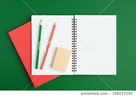 Notebook with pencil. White page on dark green color background, spiral notepad on table. Top view Copy Space. Blank paper sheet, office supplies. Greeting card mockup. Modern Minimal business mock up Notebook with pencil. White page on dark green color background, spiral notepad on table. Top view Copy Space. Blank paper sheet, office supplies. Greeting card mockup. Modern Minimal business mock up 106015293