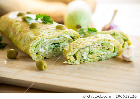 vegetable zucchini roll with garlic cheese filling inside. vegetable zucchini roll with garlic cheese filling inside. 106018126