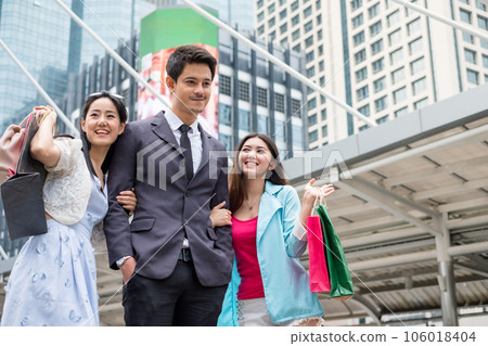 Asian beauty woman cuddle snuggle with smart young businessman are happy and cheerful Asian beauty woman cuddle snuggle with smart young businessman are happy and cheerful 106018404