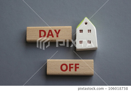 Day off symbol. Concept word Day off on wooden blocks. Beautiful grey background. Business and Day off concept. Copy space 106018738
