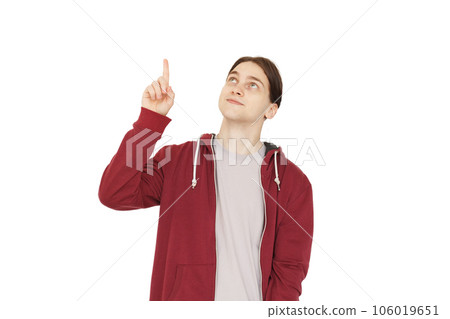 Handsome man pointing finger up against white studio wall background 106019651