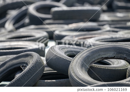 Old car tires on silaged fodder on a dairy farm Old car tires on silaged fodder on a dairy farm 106021169