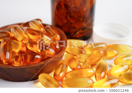 Fish oil or Cod liver oil gel in capsules with omega 3 vitamins, supplementary healthy food Fish oil or Cod liver oil gel in capsules with omega 3 vitamins, supplementary healthy food 106021246