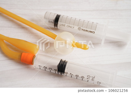 Foley catheter and urine drainage bag collect urine for disability or patient in hospital. Foley catheter and urine drainage bag collect urine for disability or patient in hospital. 106021256