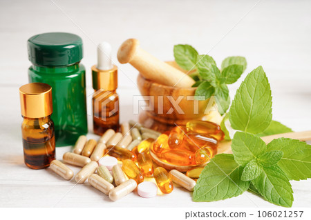 Alternative medicine herbal organic capsule with vitamin E omega 3 fish oil, mineral, drug with herbs leaf natural supplements for healthy good life. 106021257