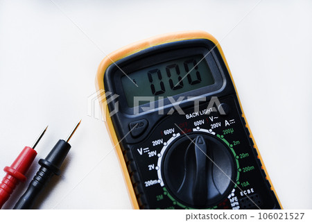 Multimeter on a white background. Voltage and current meter. 106021527