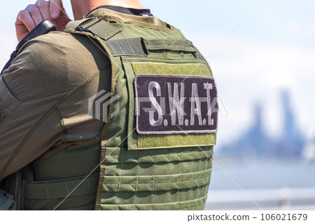 equipped swat soldier standing on a peir 106021679