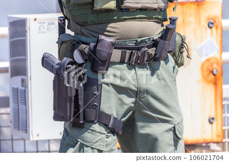 equipped swat soldier standing on a peir 106021704