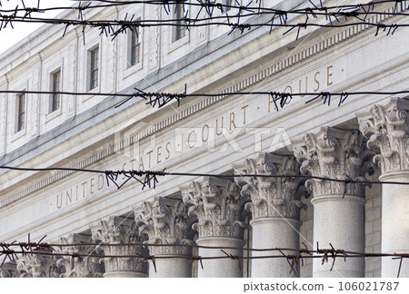 Barbed wire fence in front of United States Court House. Courthouse facade with columns, lower Manhattan, New York Barbed wire fence in front of United States Court House. Courthouse facade with columns, lower Manhattan, New York 106021787