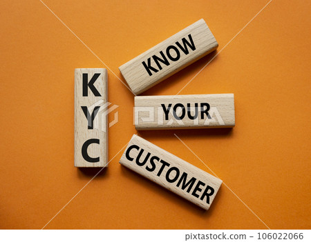 KYC - Know Your Customer. Wooden cubes with word KYC. Beautiful red background. Business and Know Your Customer concept. Copy space KYC - Know Your Customer. Wooden cubes with word KYC. Beautiful red background. Business and Know Your Customer concept. Copy space 106022066