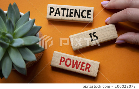 Patience is Power symbol. Concept words Patience is Power on wooden blocks. Beautiful orange background. Businessman hand. Business and Patience is Power concept. Copy space. 106022072