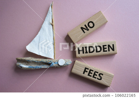 No Hidden Fees symbol. Concept words No Hidden Fees on wooden blocks. Beautiful pink background with boat. Business and No Hidden Fees concept. Copy space. 106022165