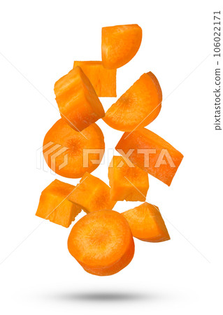 Carrot slices from different sides scatter in different directions. Flying vegetables. An isolate of a flying carrot that casts a shadow. Carrot slices from different sides scatter in different directions. Flying vegetables. An isolate of a flying carrot that casts a shadow. 106022171