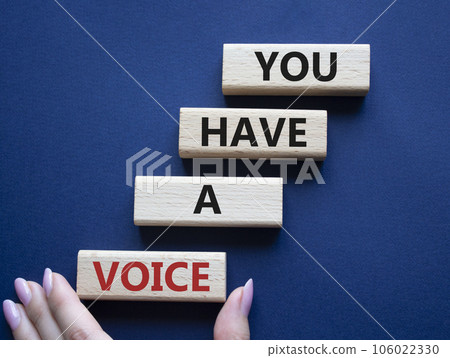 You have a voice symbol. Concept words You have a voice on wooden blocks. Beautiful deep blue background. Businessman hand. Business and You have a voice concept. Copy space. You have a voice symbol. Concept words You have a voice on wooden blocks. Beautiful deep blue background. Businessman hand. Business and You have a voice concept. Copy space. 106022330