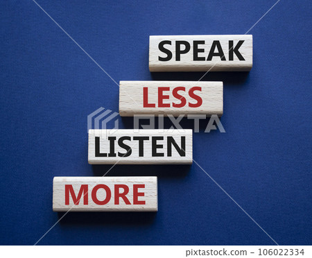 Speak less Listen more symbol. Wooden blocks with words Speak less Listen more. Beautiful deep blue background. Business and Speak less Listen more concept. Copy space. 106022334
