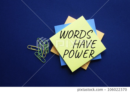 Words have power symbol. Yellow steaky note with words Words have power. Beautiful deep blue background. Business and Words have power concept. Copy space. 106022370