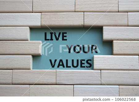 Live your values symbol. Concept words 'Live your values' on wooden blocks. Beautiful grey green background. Business and Live your values concept. Copy space. Live your values symbol. Concept words 'Live your values' on wooden blocks. Beautiful grey green background. Business and Live your values concept. Copy space. 106022568