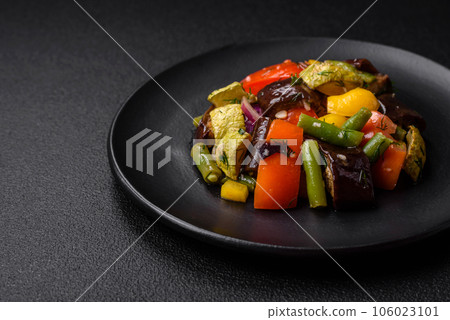 Delicious juicy fresh salad of baked eggplant, tomatoes, zucchini, onions 106023101