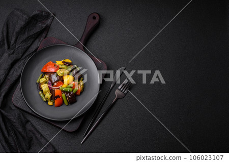Delicious juicy fresh salad of baked eggplant, tomatoes, zucchini, onions Delicious juicy fresh salad of baked eggplant, tomatoes, zucchini, onions 106023107