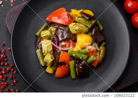 Delicious juicy fresh salad of baked eggplant, tomatoes, zucchini, onions 106023122