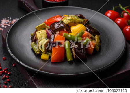 Delicious juicy fresh salad of baked eggplant, tomatoes, zucchini, onions 106023123