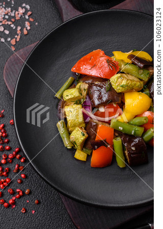 Delicious juicy fresh salad of baked eggplant, tomatoes, zucchini, onions 106023124