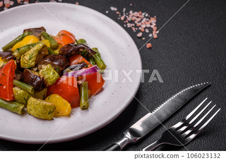 Delicious juicy fresh salad of baked eggplant, tomatoes, zucchini, onions 106023132