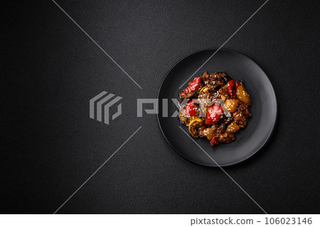 Delicious juicy fresh salad of baked eggplant, tomatoes, sweet peppers, sesame seeds Delicious juicy fresh salad of baked eggplant, tomatoes, sweet peppers, sesame seeds 106023146